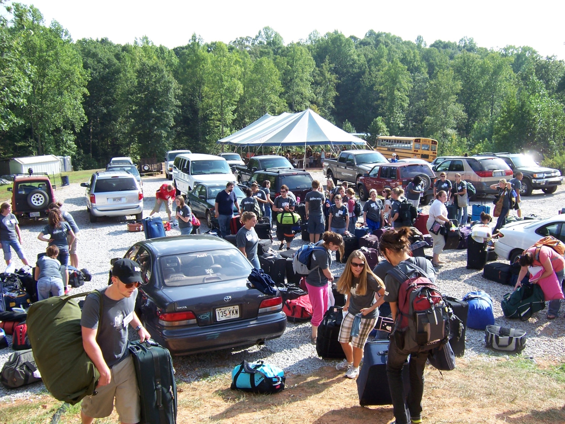Racers arriving at training camp in Gainesville, GA with luggage and squad mates