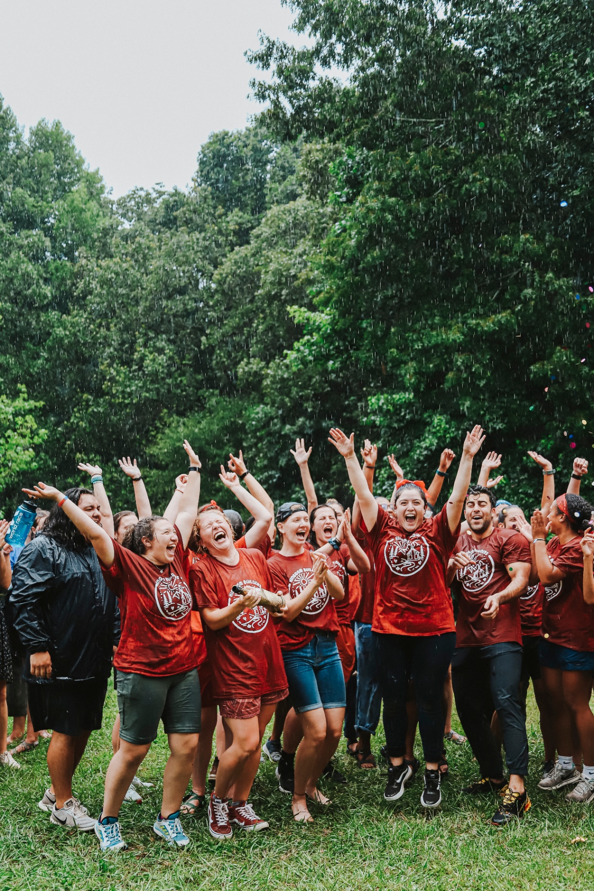 Squad cheering in the rain with confetti during a commissioning moment