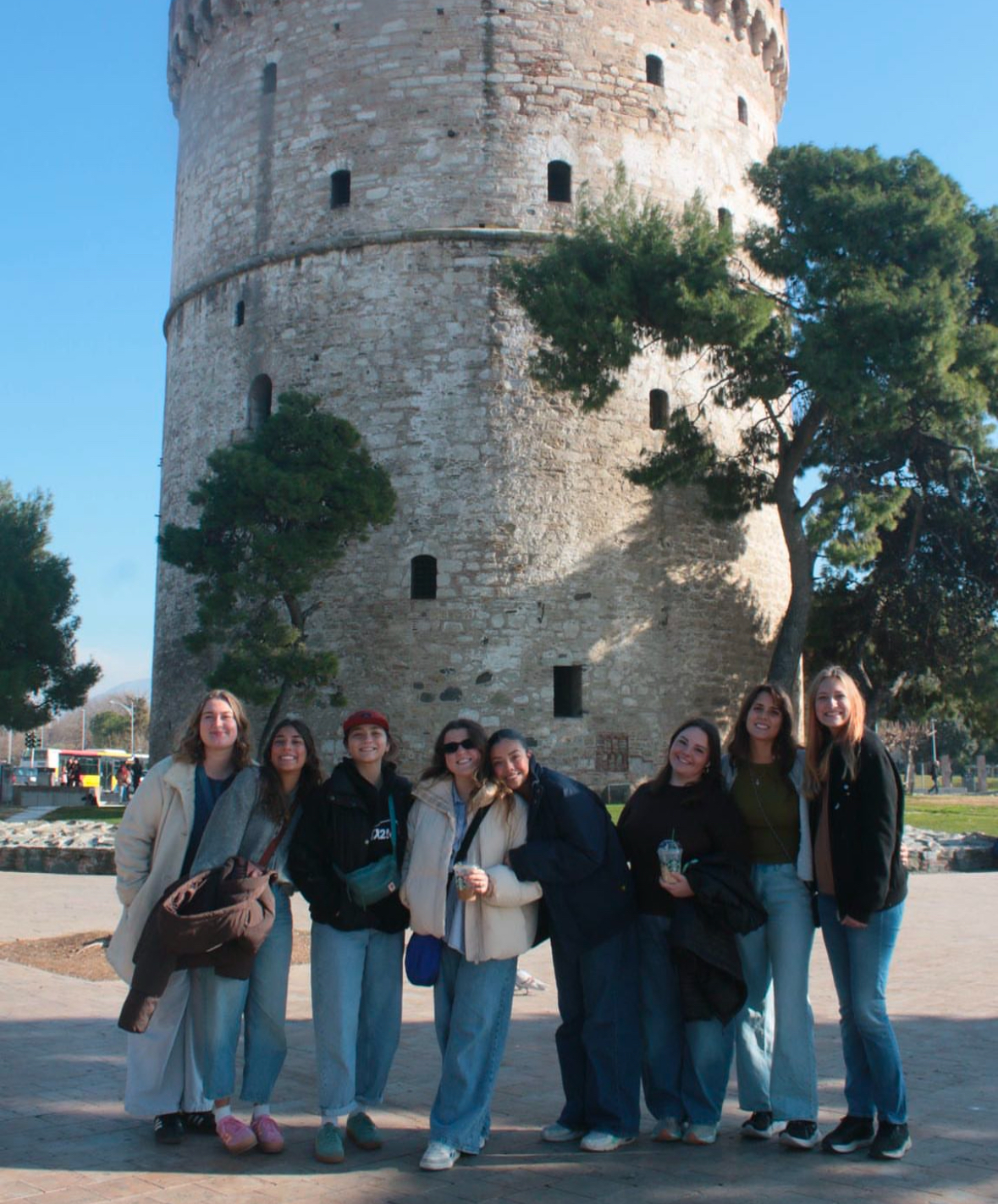 World Race squad in front of a historic tower in Greece