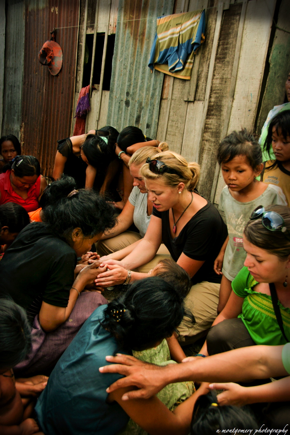World Race team and locals gathered in a prayer circle