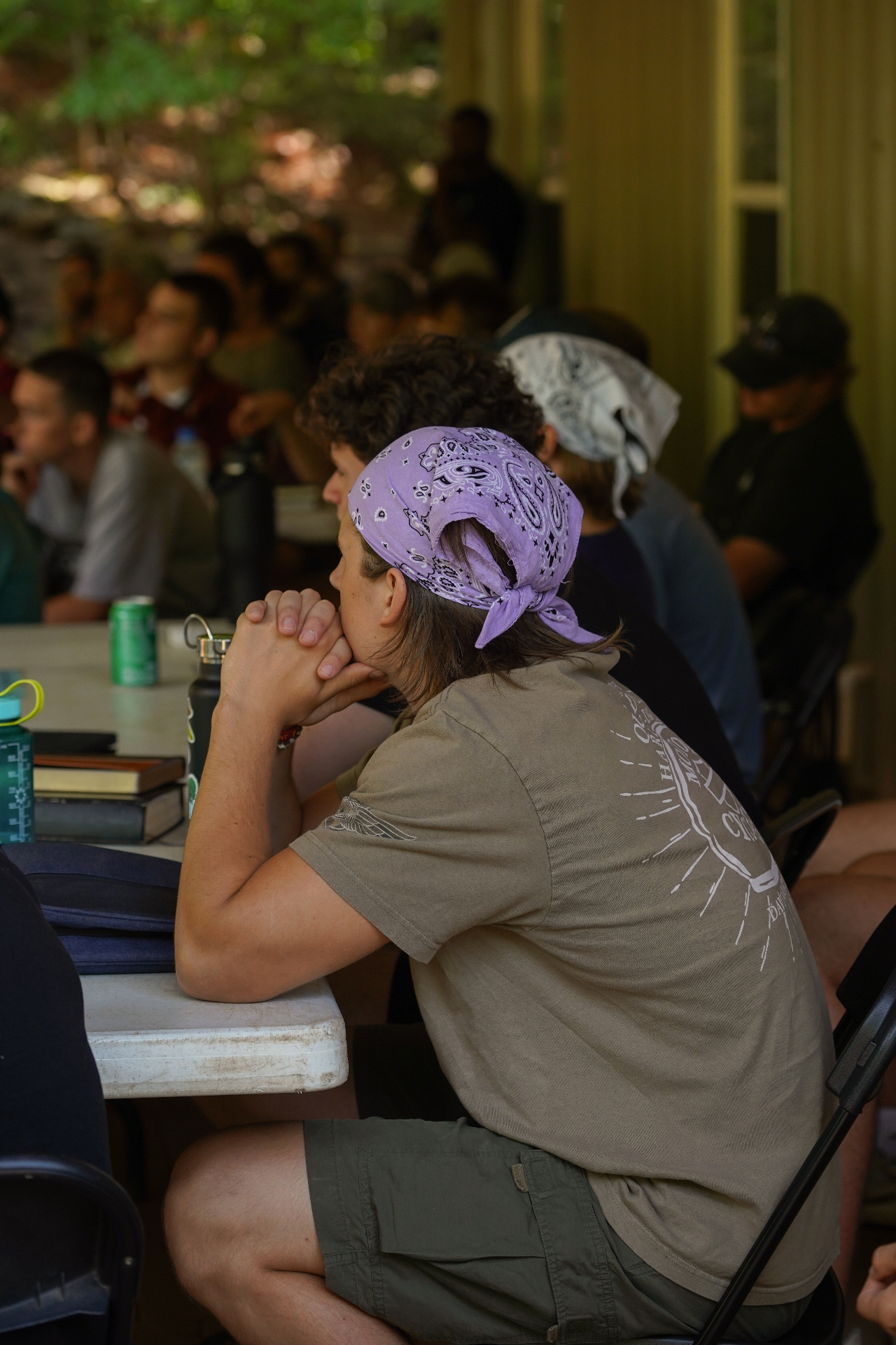 A racer listening closely during a training camp teaching session