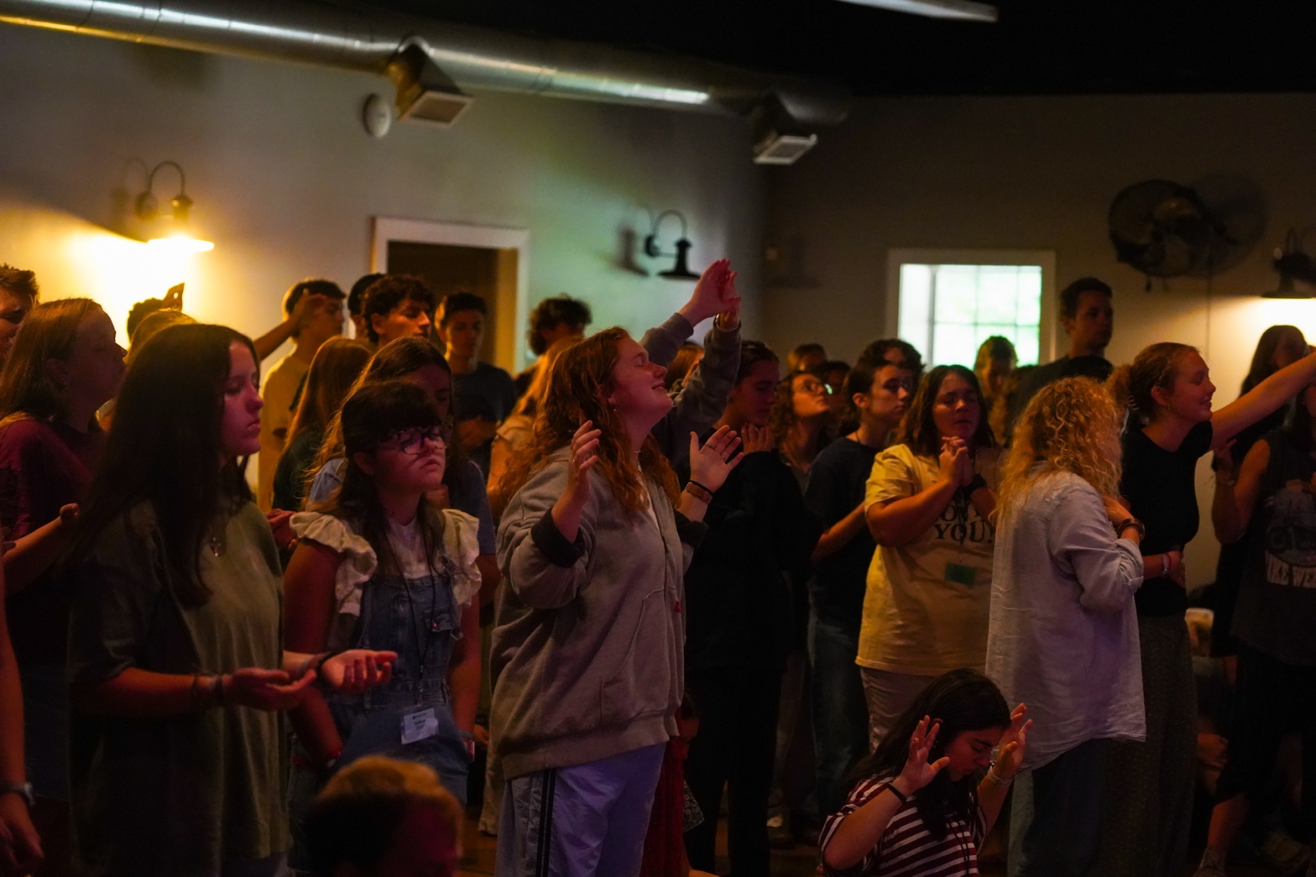 A squad gathered in worship during training camp
