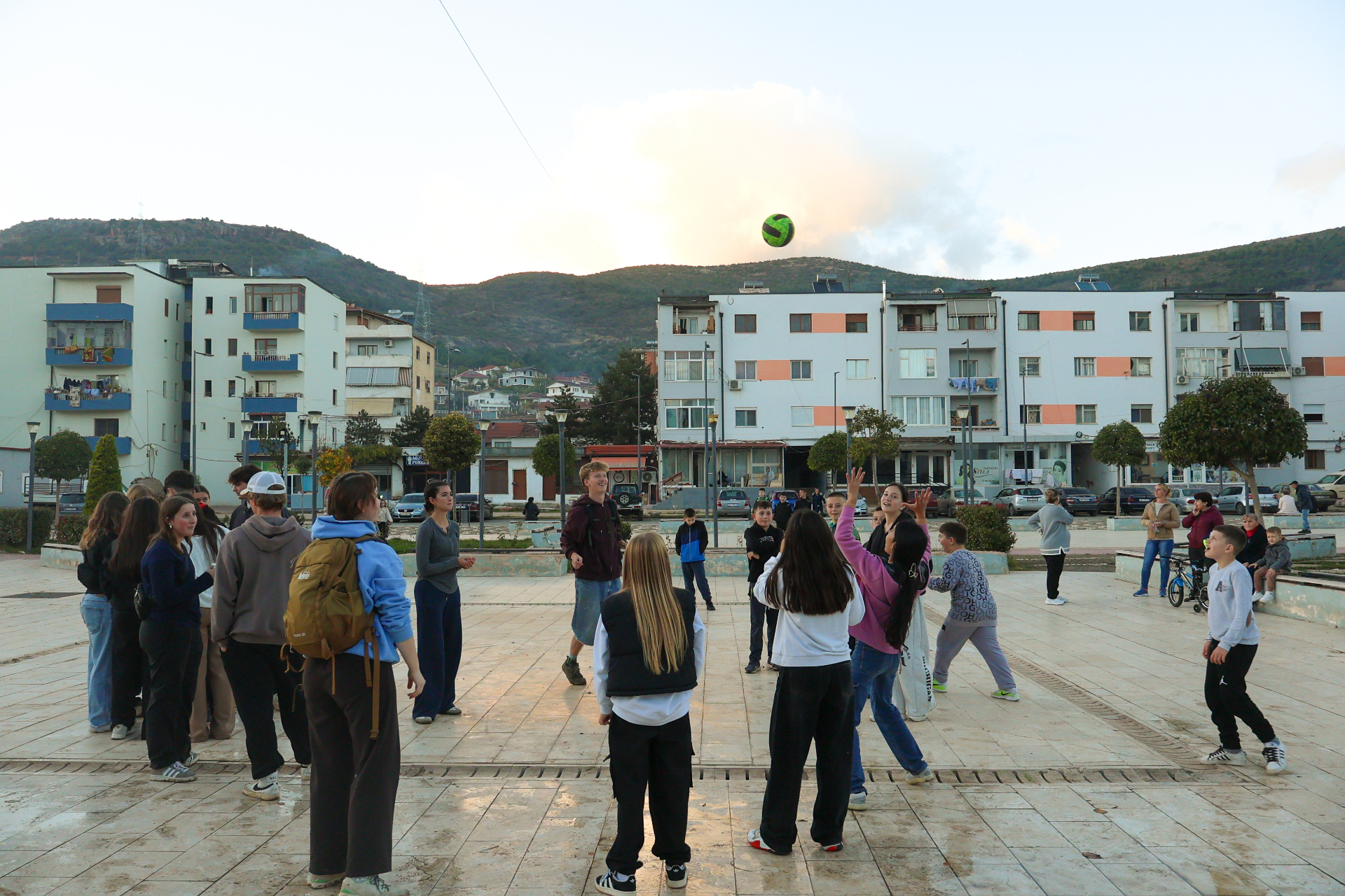 World Race participants and local youth in an Albania town square