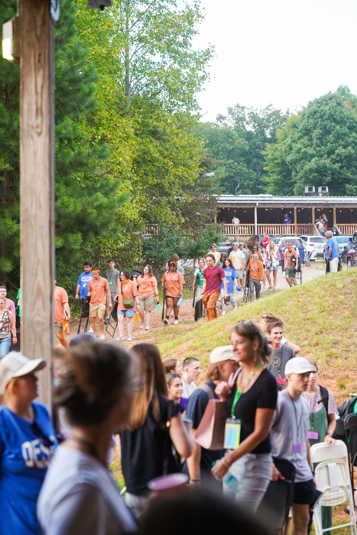 Groups moving across the training camp grounds between activities