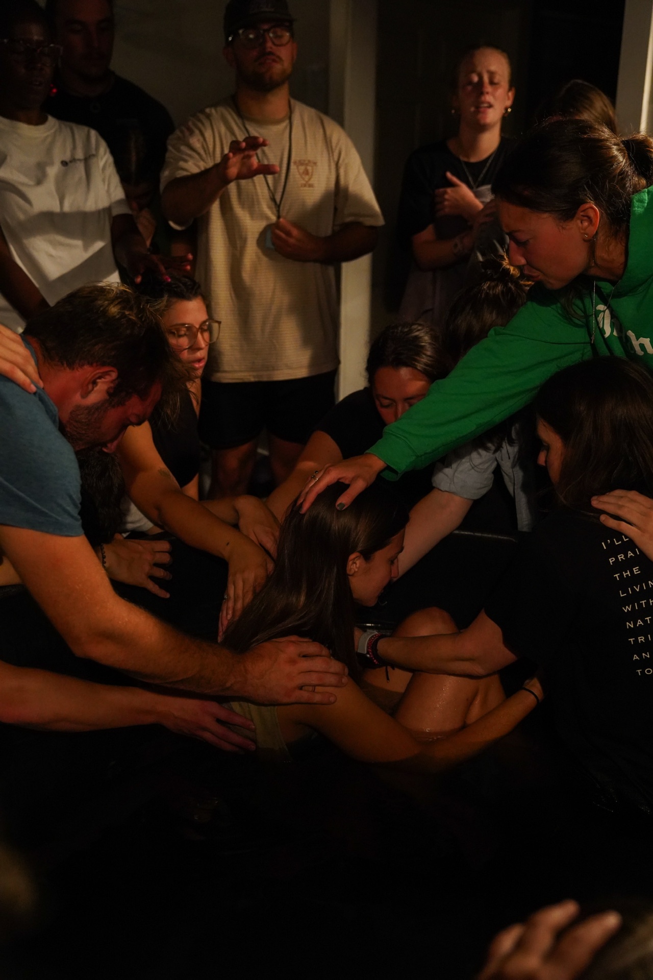 Baptism moment, water flying, the crowd erupting on the bank.