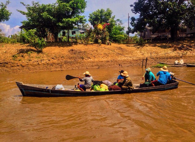 Boat traveling an Amazon tributary