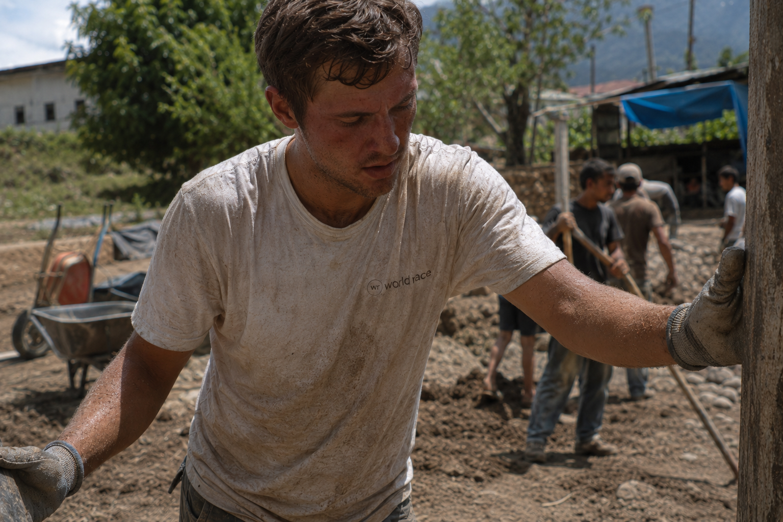 Mixing concrete in the heat of a Brazilian favela