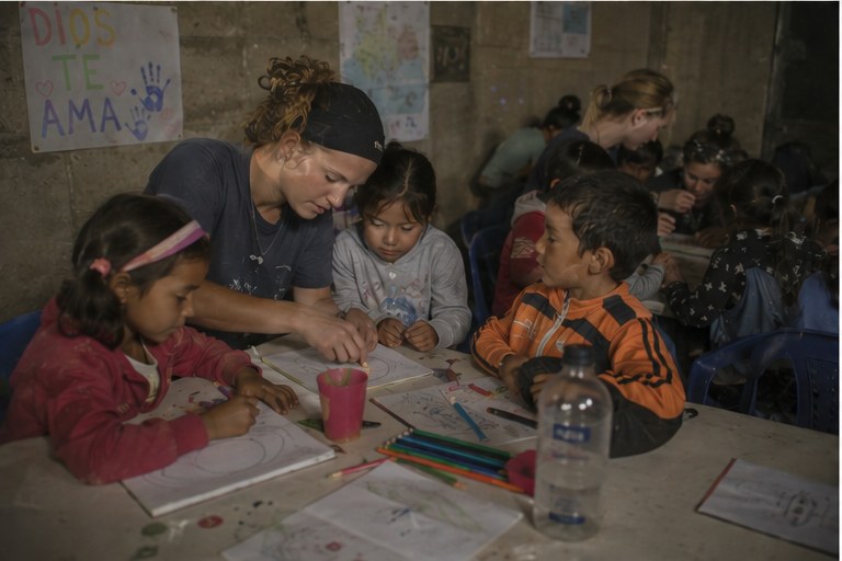 Drawing with kids in a community center