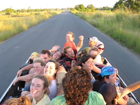 Squad piled in the back of a truck on a rural road in Mozambique