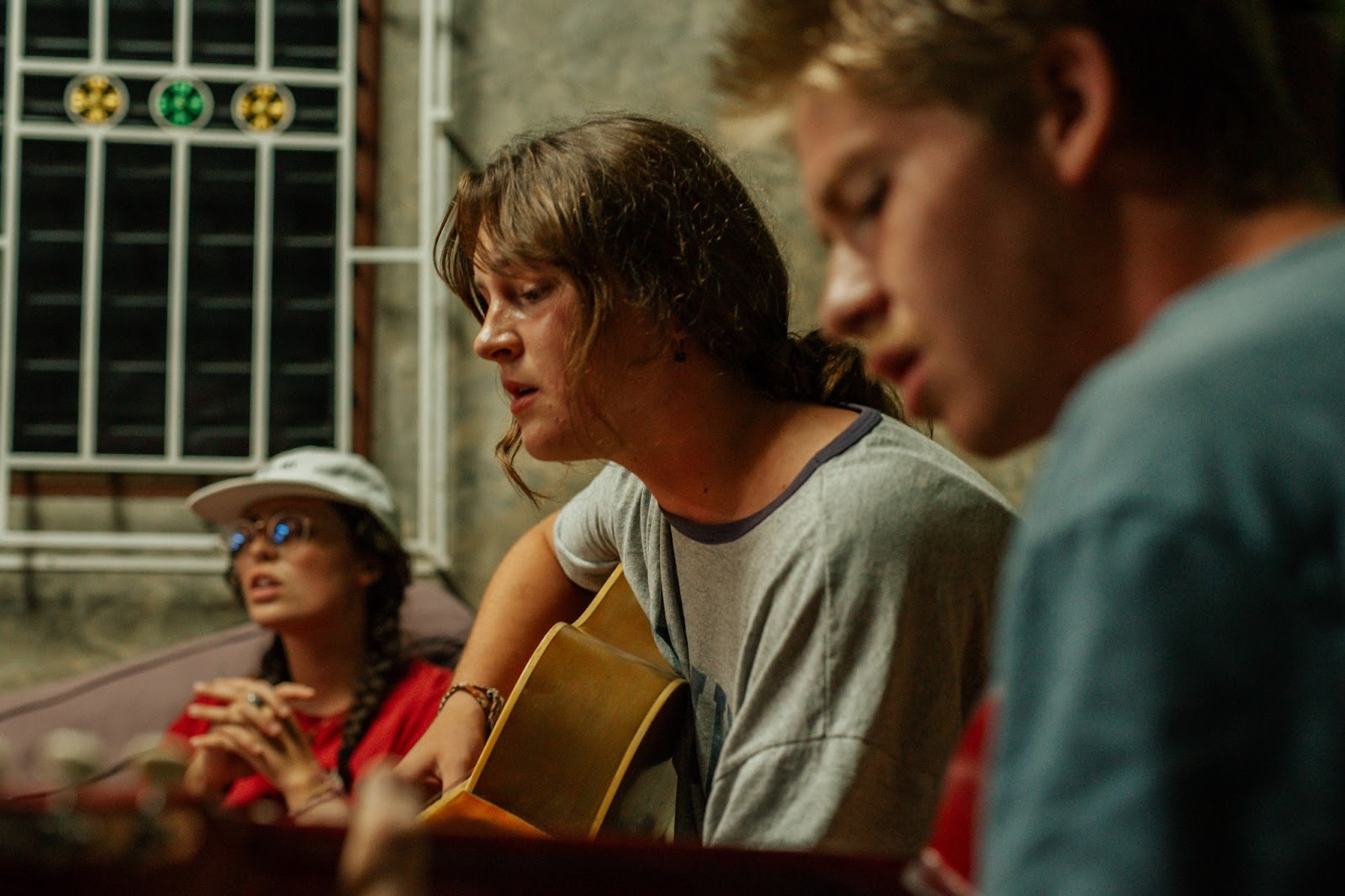 Racers leading worship with guitar in Thailand